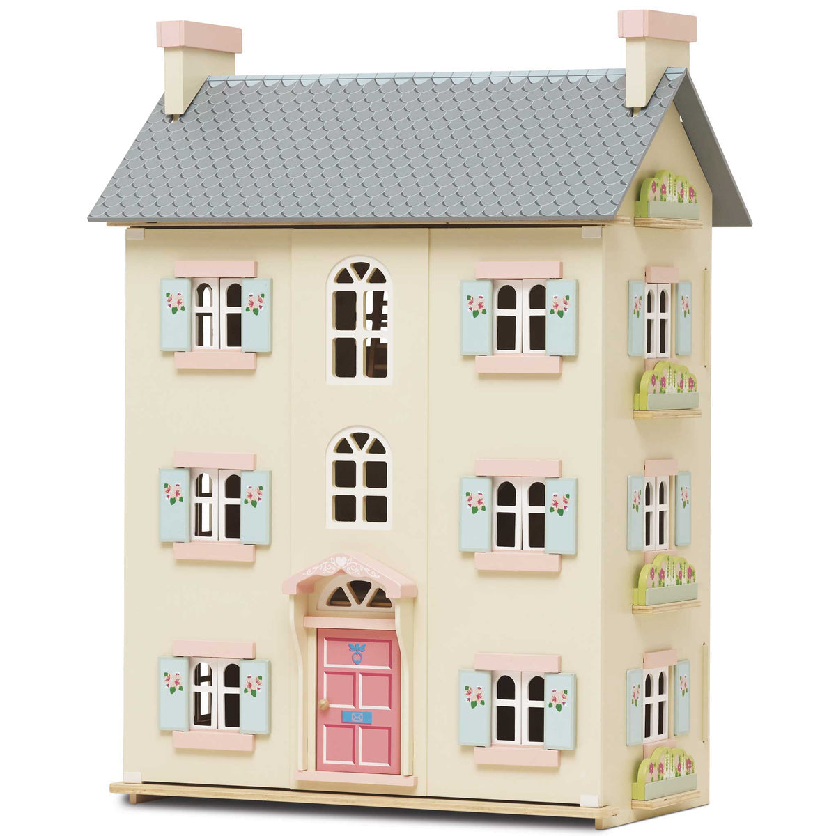 Toy dollhouse with pastel colors on a white background